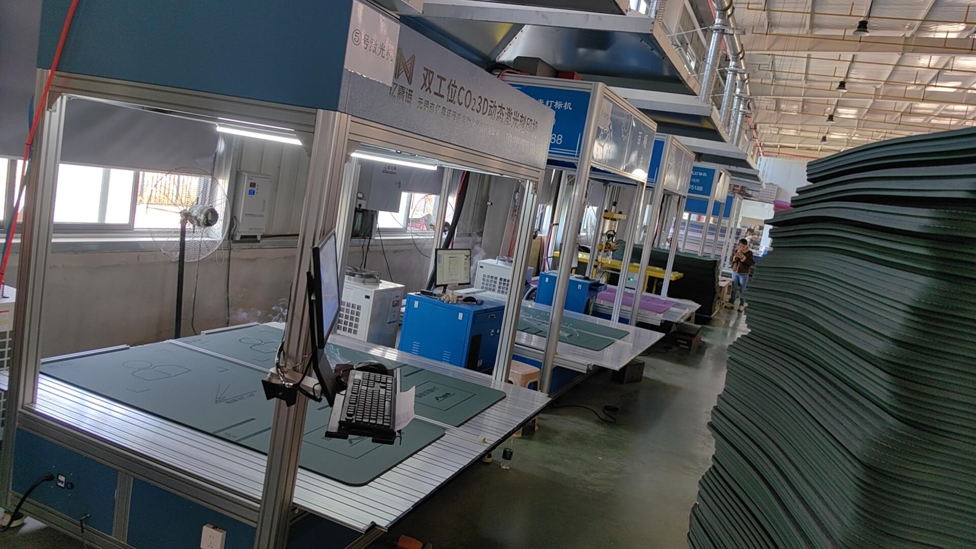 yoga mat laser marking workshop with stacked semi-finished mats